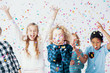 © Photographee.eu - Happy girls and boys having fun together during birthday party with confetti