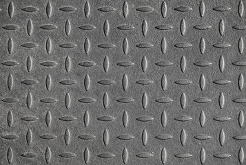 Gray diamond plate metal wall pattern