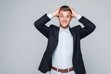 Portrait of a young business man looking depressed from work isolated over white background