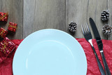 Fototapeta  - Empty Blue plate and Christmas Decoration Equipment on wooden floor.