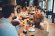 © djile - Young happy couple at a date in a coffee shop
