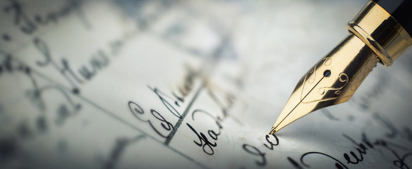 Fountain pen on an vintage handwritten letter. Old history background. Retro style.