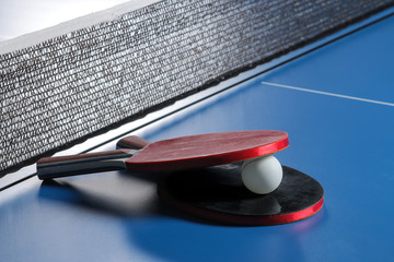 Wall Mural - Ping pong. Accessories for table tennis racket and ball on a blue tennis table. Sport. Sport game.