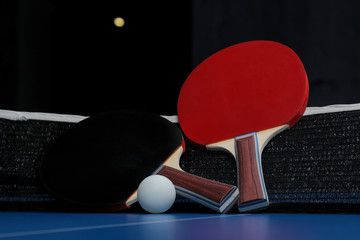 Wall Mural - Ping pong. Accessories for table tennis racket and ball on a blue tennis table. Sport. Sport game.