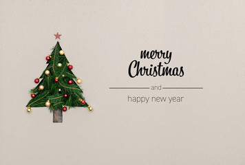 merry christmas and happy new year greetings in vertical top view cardboard with natural eco decorat