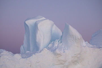 Wall Mural - beautiful iceberg in the pink and purple alpenglow light. disko bay, greenland.