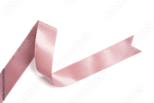 Fotografía pink ribbon in roll on white