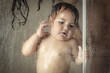 © ADDICTIVE STOCK - Cheerful mother with baby taking shower