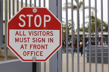 A Sign At A Closed Campus Advises Visitors To Sign In