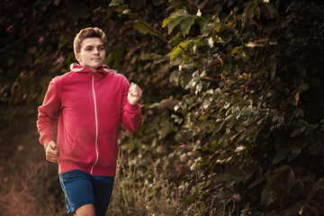 man jogging along a country road