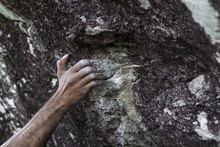 Chalky Hand Of Man Climbing On Rocks