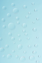Close-up View Of Transparent Water Drops On Light Blue Background