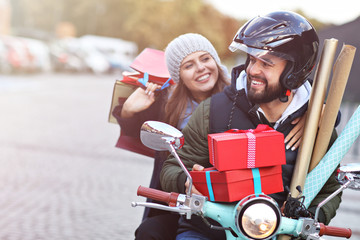 Sticker - Portrait of happy couple with shopping bags after shopping in city