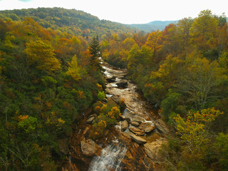 Aerial Drone view of Graveyard fields and waterfalls in Autumn / Fall foliage.   Blue Ridge in the Appalachian mountains near Asheville, North Carolina. 