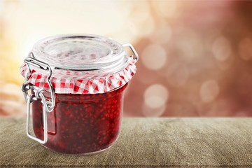 Wall Mural - Glass jar with raspberry jam