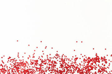 Wall Mural - Red confetti on white background