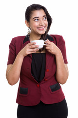 Wall Mural - Young happy Indian businesswoman smiling while thinking and hold