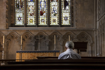 A man praying in a church