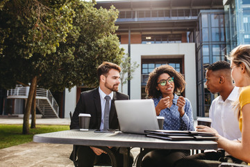 Wall Mural - Business professionals discussing work at office cafeteria