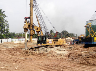 Wall Mural - Bore pile rig machine at the construction site in Malacca, Malaysia. The machine used to driven pile for building foundation work.