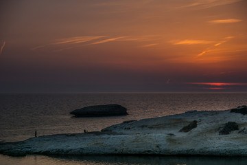 Limestone rock with arch, S`Archittu di Santa Caterina in Oristano Province, Sardinia, Italy captured in summer at sunset.