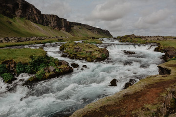 Fossalar river (waterfall) near Vatnajokull national park on Ring road in summer, Iceland, vintage look with grain
