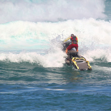 MAUI, HAWAII-NOV 10: Unidentified Lifeguard On A Jet Ski Practices Rescues In Heavy Winter Surf.
