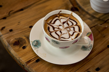 Cup of cappuccino on table