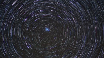 Wall Mural - stars rotating north pole star with trails. night sky polaris. time lapse.