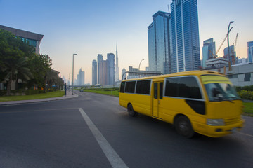 Poster - Dubai city downtown and bus moving on the road