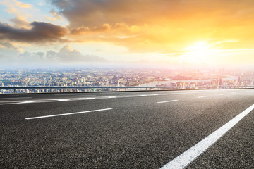 Panoramic city skyline and buildings with empty asphalt road