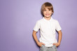 © Pixel-Shot - Little boy in t-shirt on color background