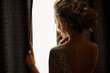 © Wedding photography - Wedding. Beautiful bride looking to window in future
