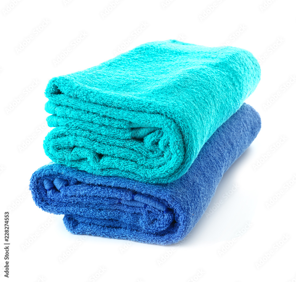 Stack of colorful towels on white background