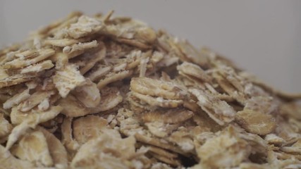 Poster - Hill of oatmeal on a white background, rotation 360 degrees. 