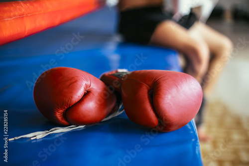Tela Red boxing gloves on boxing ring