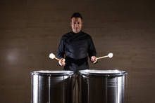 Percussionist Practicing With Two Drums
