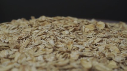 Poster - Cereals on a bowl dark background, rotation 360 degrees. 