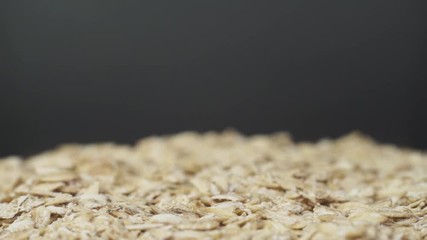 Poster - Cereals on a bowl dark background, rotation 360 degrees. 