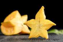 Slice Ripe Star Fruit Carambola Or Star Apple ( Starfruit ) On Dark Background