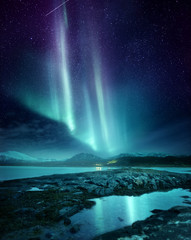 a spectacular northern light aurora display lighting up the night sky in northern norway. a popular 