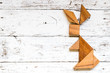 © bankrx - Tangram puzzle in rabbit shape on old white wood background