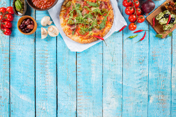 Various kind of italian food served on wood