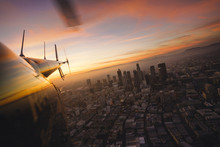 View Of The City At Sunset From A Helicopter