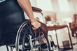 Close up. Disabled Man on Wheelchair in Office.