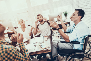 Wall Mural - Young Managers Relaxing on Break in Modern Office.