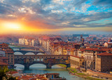Ponte Vecchio over Arno river at sunset in Florence, Italy
