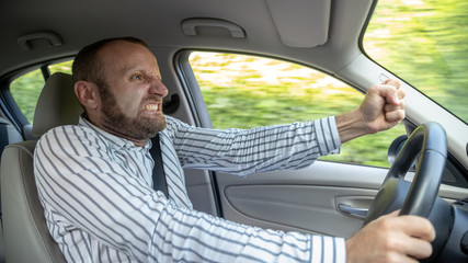 aggressive and crazy driver in his car