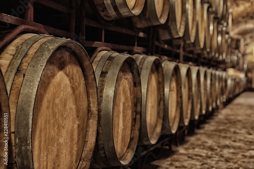 Fotomural Large wooden barrels in wine cellar, closeup