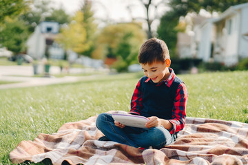 Wall Mural - Little boy in a autumn park